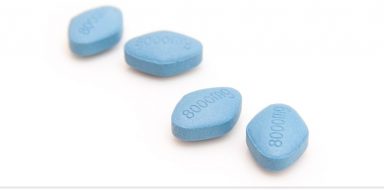 Four blue pills on a white background.